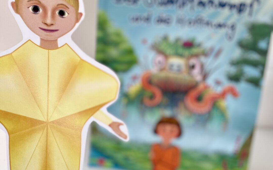 Ausgeschnittene Figur Hoffnung vor Kinderbuch zu Hoffnung und Angst