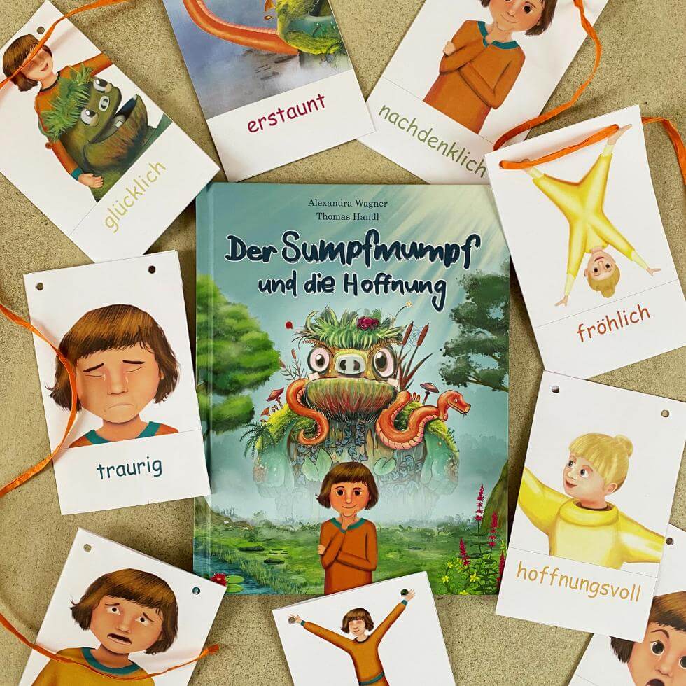 Kinderbuch-gefuehle-mit-gefuehlskarten Kinderbuch "Der Sumpfmumpf und die Hoffnung" mit Gefühlskarten drumrum liegend